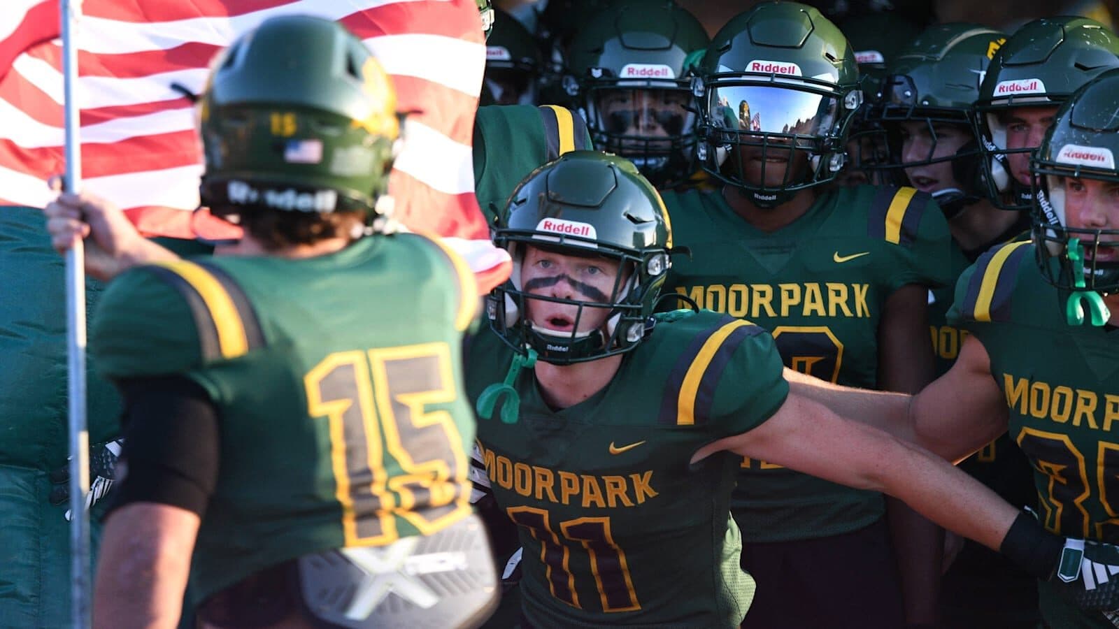 Moorpark Musketeers varsity football players in green and gold
